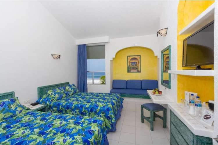 Hotel Posada Real Ixtapa Habitaciones para 4 personas con 2 camas matrimoniales, pantalla plana, TV cable, aire acondicionado, alberca, acceso a Playa El Palmar en Ixtapa Zihuatanejo Todo Incluido